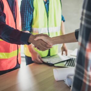 Builder shaking hands with another person