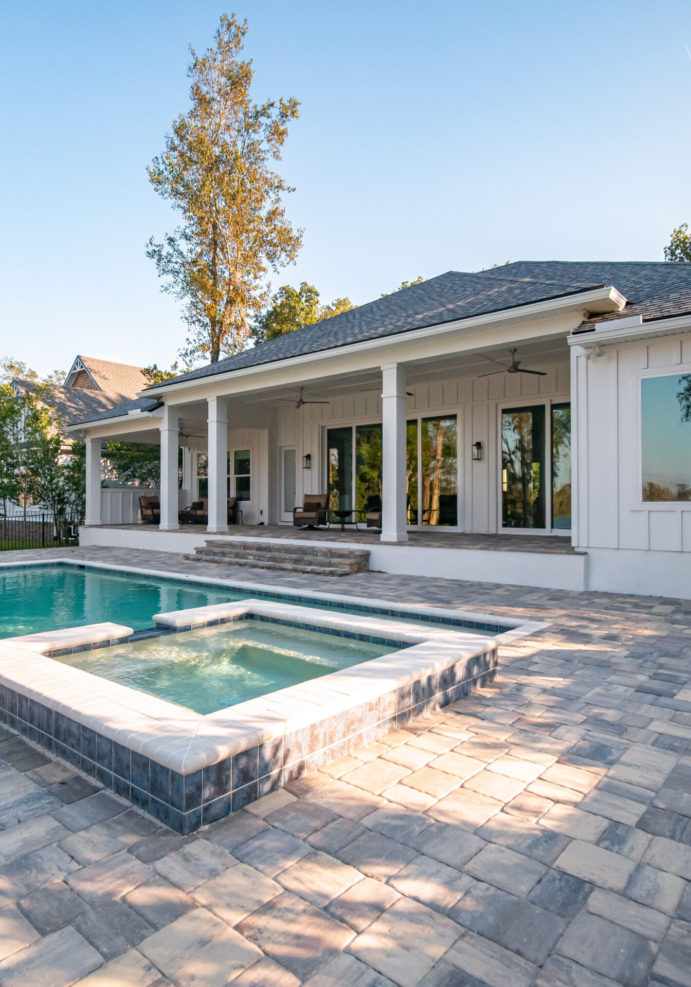 GRACO inground swimmng pool with paver patio surrounding.